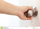 Female Hand Is Holding The Knob Stock Image Image Of Doorknob throughout measurements 1300 X 957
