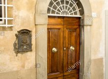 Large Wooden Doors With Brass Door Knobs And An Ornate Letter Box with regard to measurements 866 X 1390