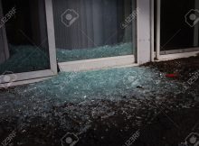 Shattered Glass In The Night Near A Sliding Glass Door Stock Photo throughout dimensions 1300 X 869