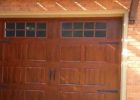 Steel Garage Doors That Mimic Look Of Wood Affordablegaragedoors pertaining to measurements 1280 X 720
