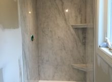 A Subtle Grey Marble Ite Shower Paired With A Bright White Cultured in measurements 2448 X 3264