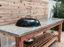 Cedar Wood Outdoor Kitchen With A Concrete Countertop And Built In with regard to size 1000 X 1334