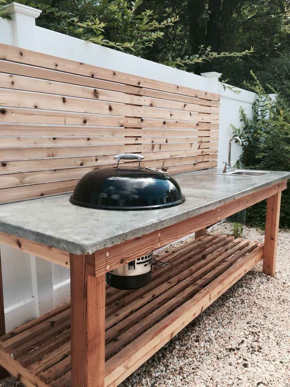 Cedar Wood Outdoor Kitchen With A Concrete Countertop And Built In with regard to size 1000 X 1334
