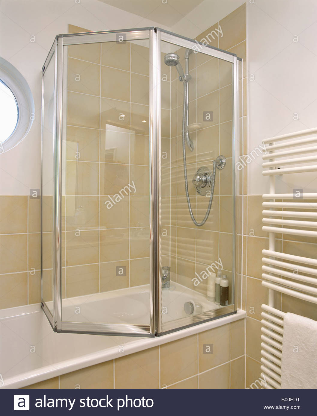 Folding Glass Shower Doors On Bath In Modern Bathroom With Neutral for size 1057 X 1390