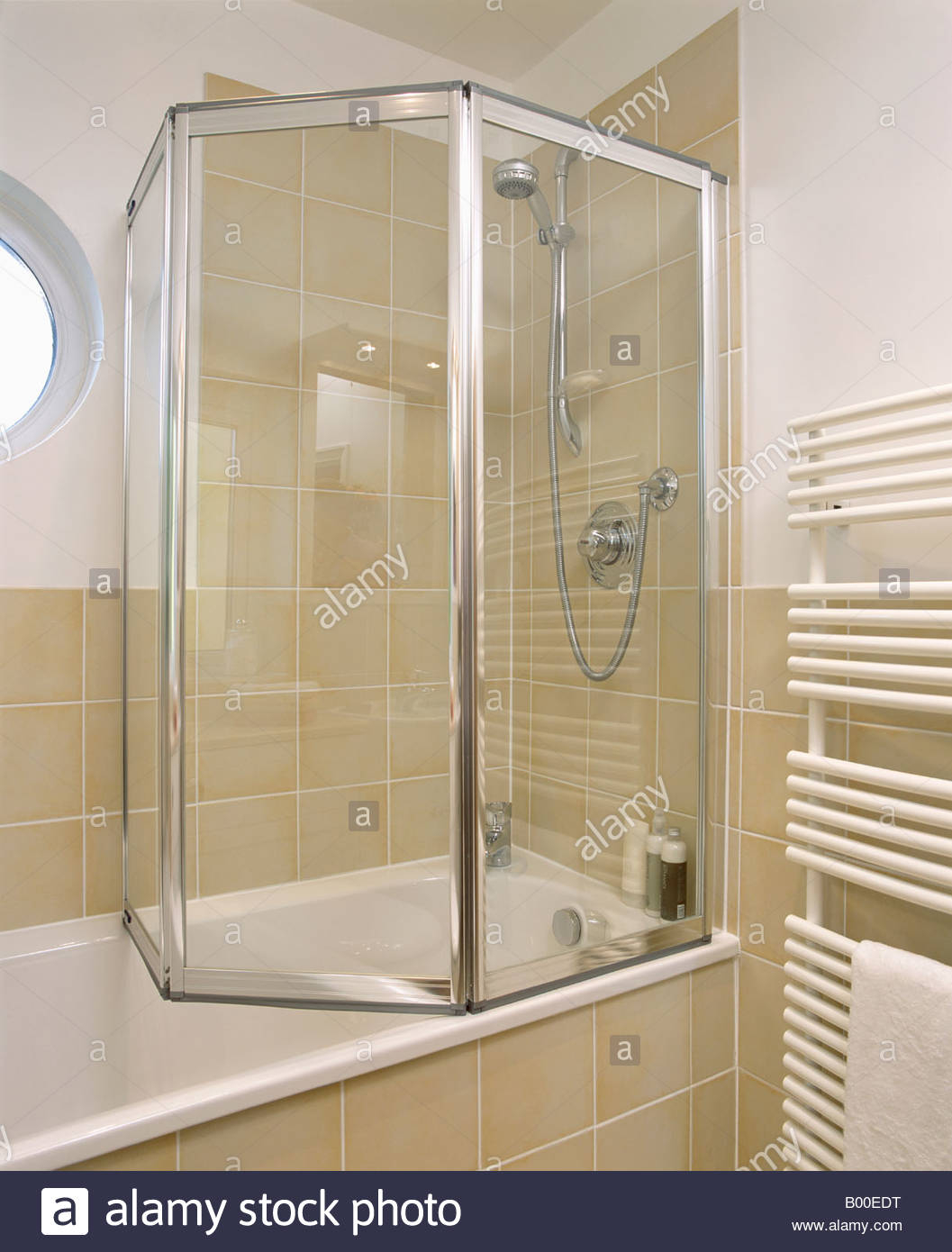 Folding Glass Shower Doors On Bath In Modern Bathroom With Neutral within size 1057 X 1390